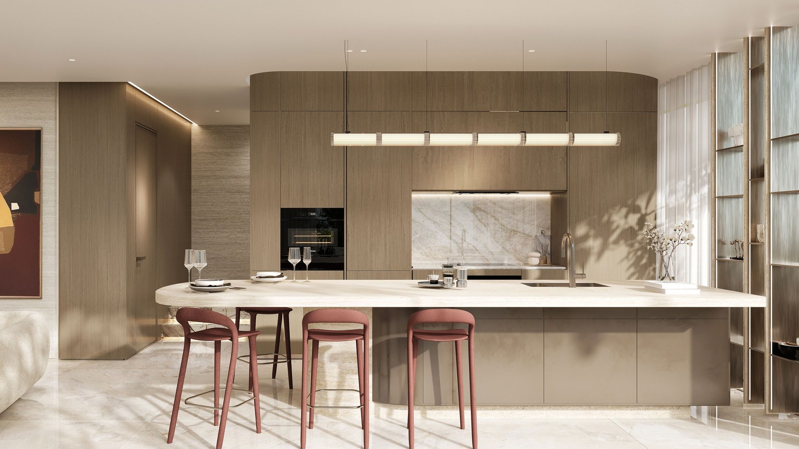 An open kitchen with a stone island, wood cabinetry and bar stools.