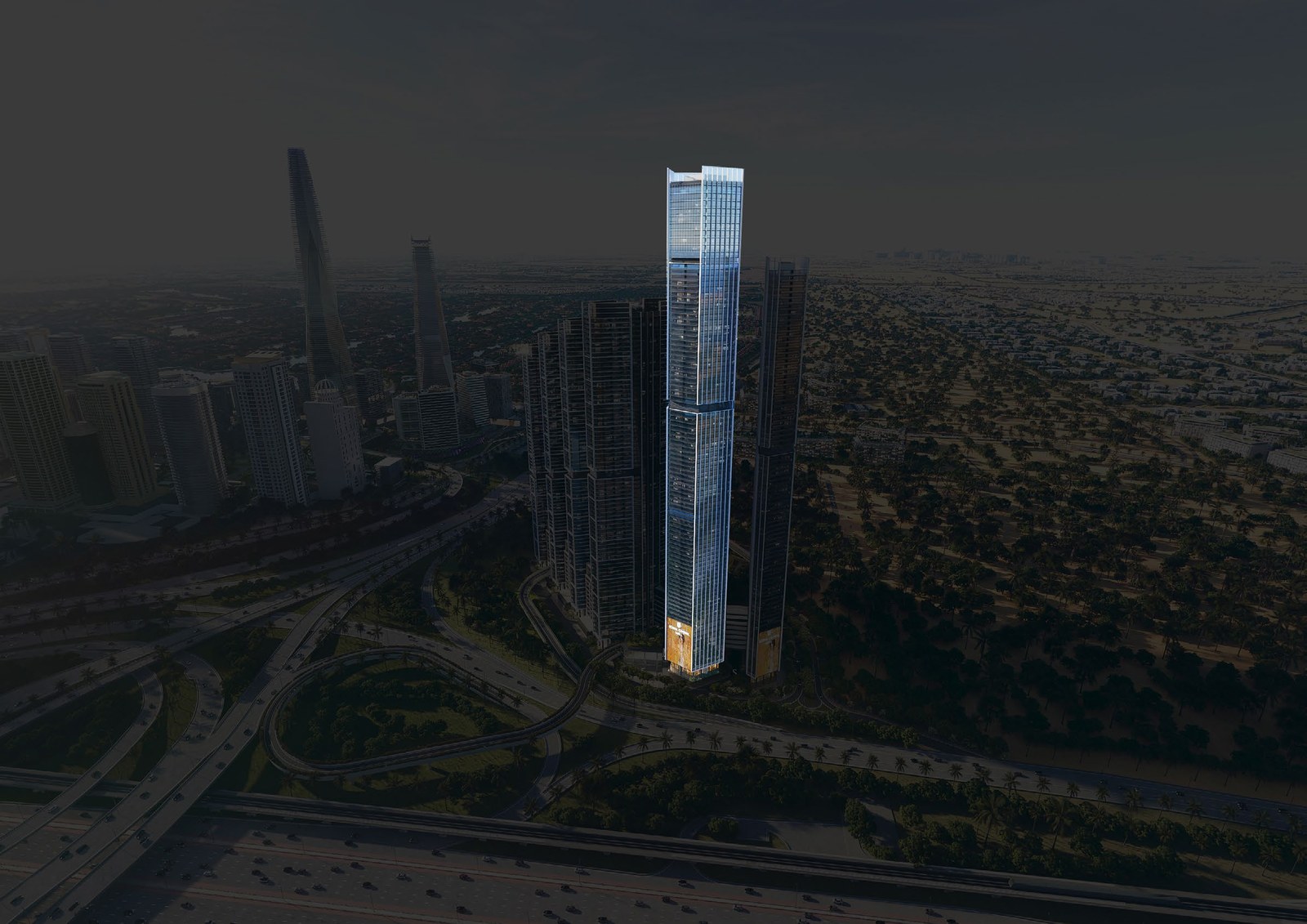 The Pinnacle at dusk: a single lit tower above the Sobha Central community.
